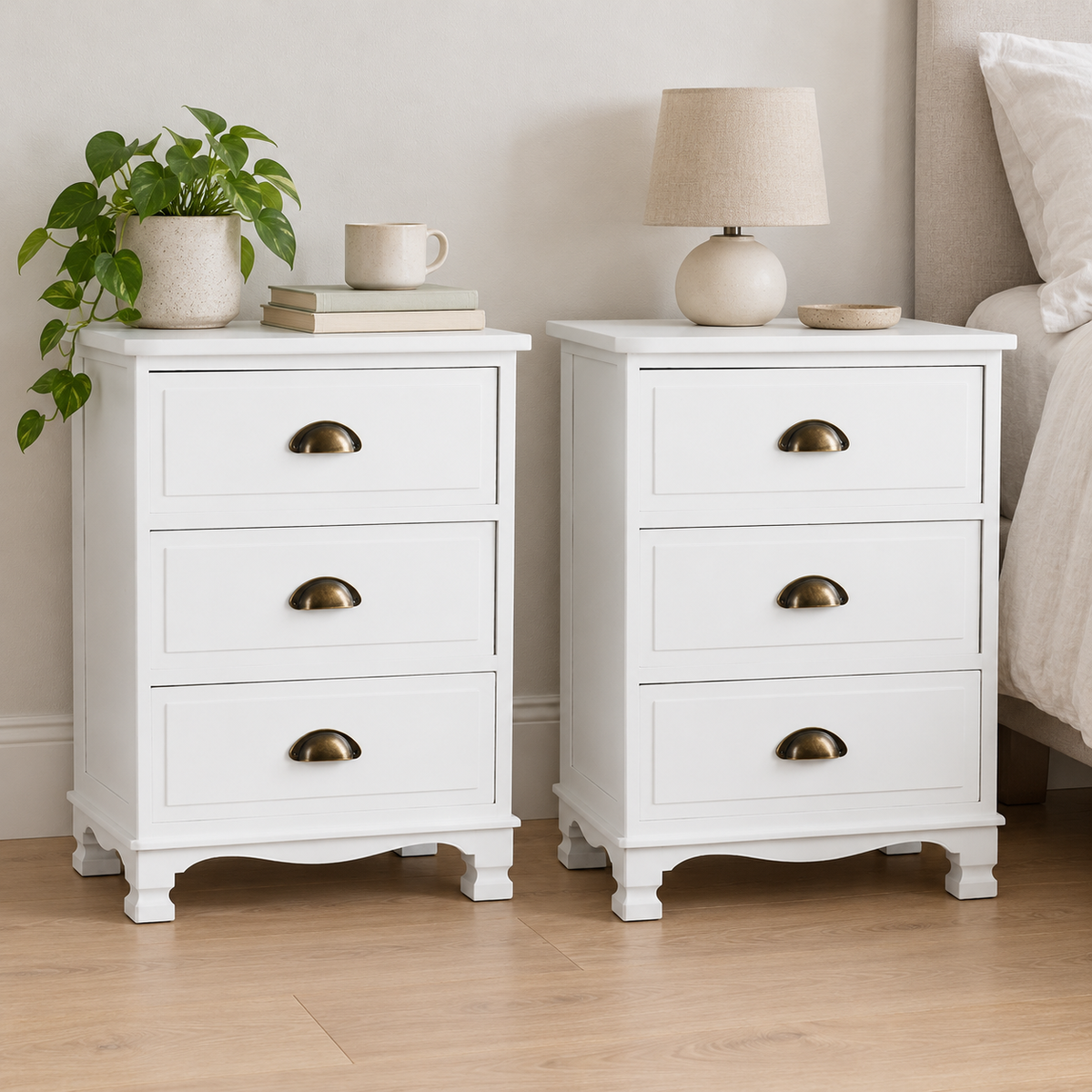 Artiss Thyme White Three Drawer Bedside Tables, Set of 2 shown in a home setting