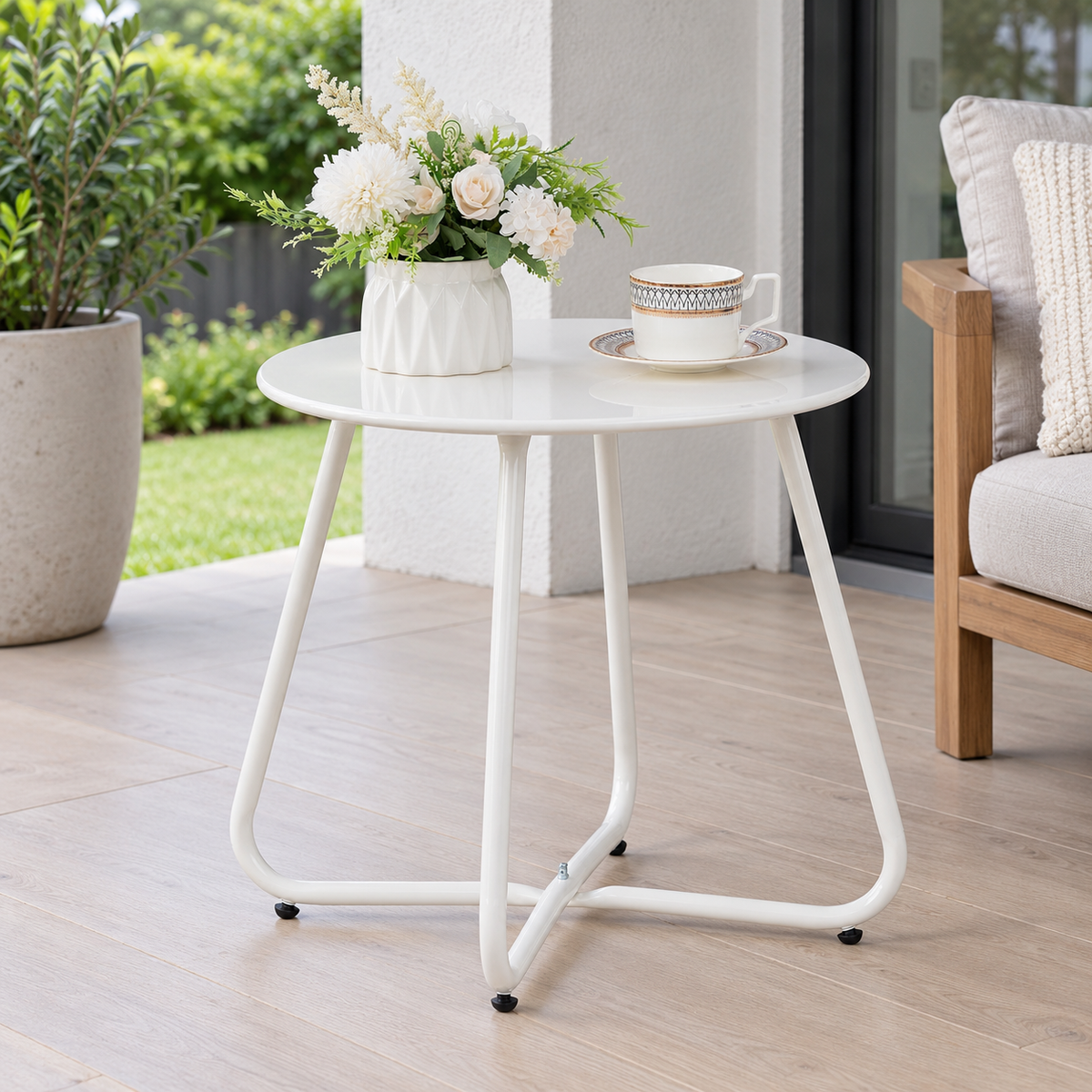 White Round Metal Outdoor Side Table shown in a home setting